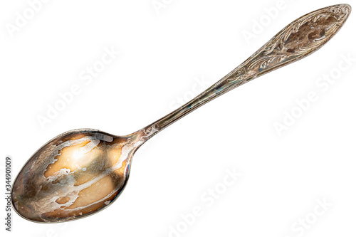 Obraz na płótnie old cupronickel spoon with visible oxidation layer isolated on white background