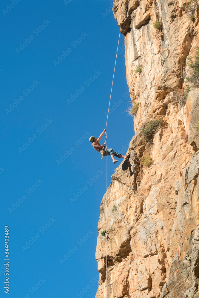 Fototapeta premium rock climber on a cliff