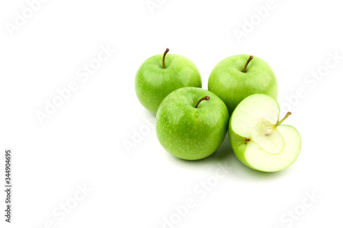 green apples and half of apple isolated on white background