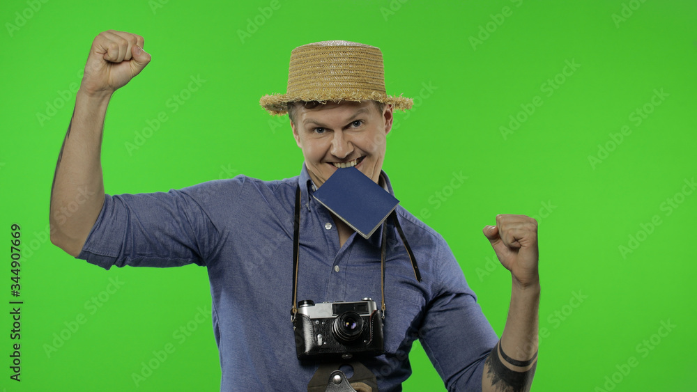 Portrait of young man tourist photographer celebrates and dances. Chroma key Portrait of young man tourist photographer celebrates and dances. Chroma key