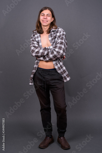 Young handsome androgynous man with shirt unbuttoned