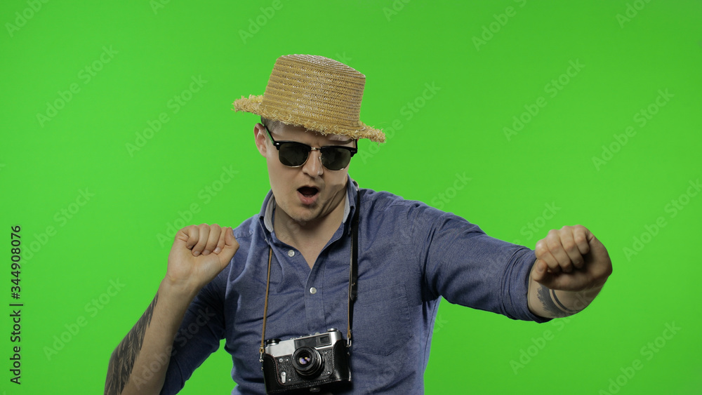 Portrait of happy man tourist photographer dances. Chroma key Portrait of happy man tourist photographer dances. Chroma key