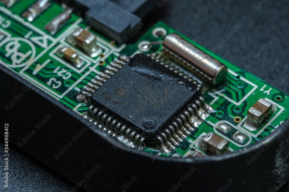 The chip of the hard disk controller with soldered elements The chip of the hard disk controller with soldered elements