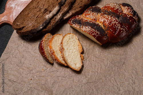 Baking, rolls, bread and milk on a dark background