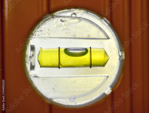 Spirit level ,used for DIY,brightly backlit with it's bubble almost centered.