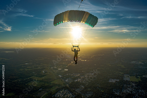 Skydiver/paraglider in the sunset
