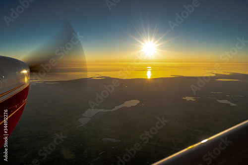 sunset over the sea from a plane