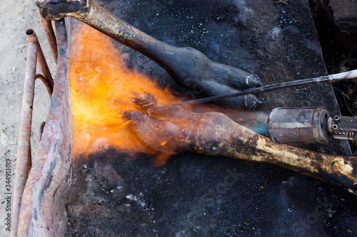 Burning camel's skin with torch, Morocco 