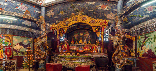 Inside the main hall of Phu Chau temple is elaborately decorated with many fragments of crockery, with a age of 3 centuries and is widely sought after by the sacred. © CravenA