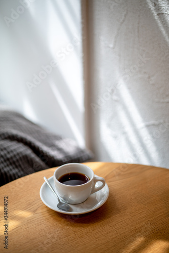 cup of black filter coffee on the table in coffee house cafe coffeebreak sunlight daylight