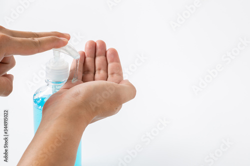 Man hands applying alcohol hand sanitizer gel for prevent spread of virus, bacteria and germs. Pandemic virus prevention and personal hygiene concept.