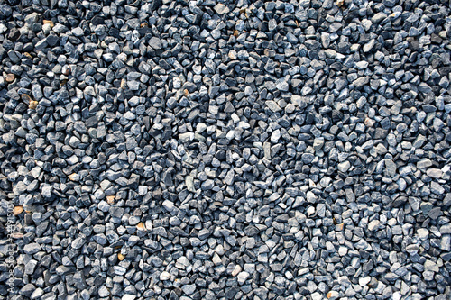 Top view of blue construction gravel texture background. Small granite stone full frame background.