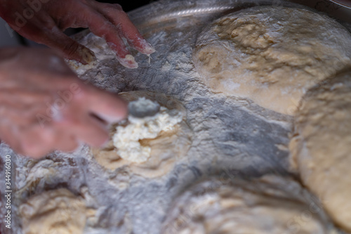 Flour dough sprinkled on a tray