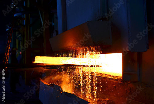 Fotografía Steel quenching at high temperature in industrial furnace at the workshop of a forge plant