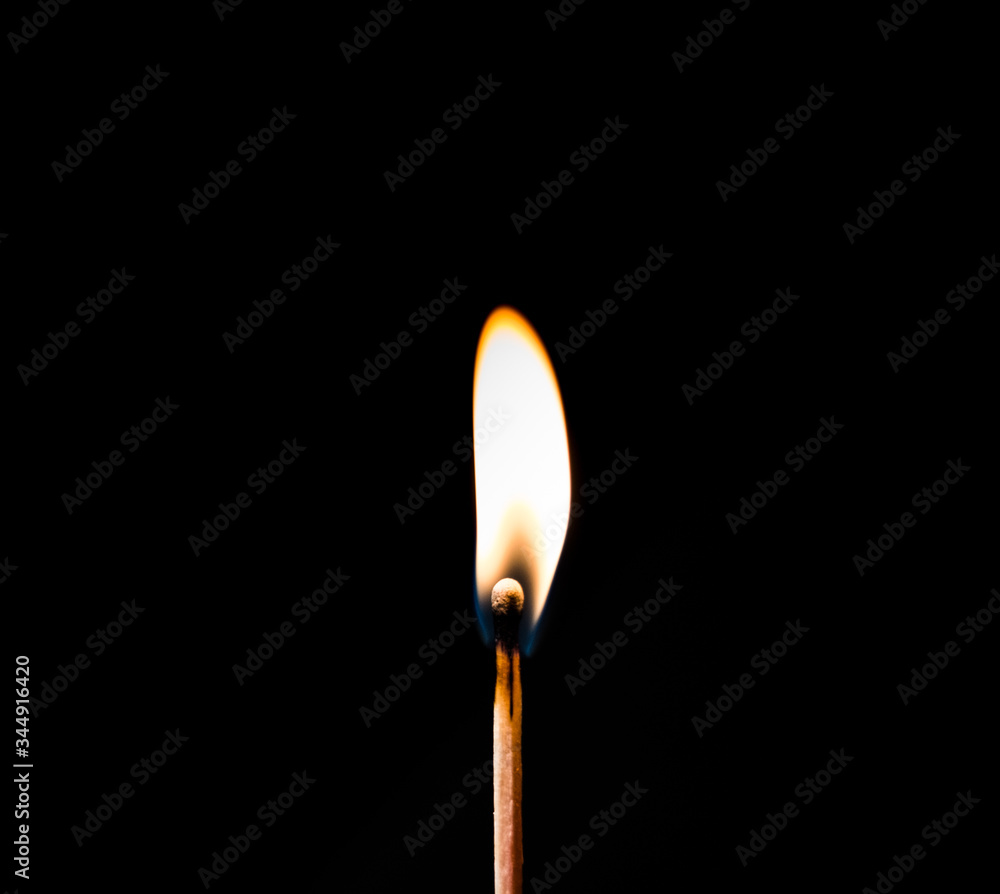 burning candle on black background burning candle on black background