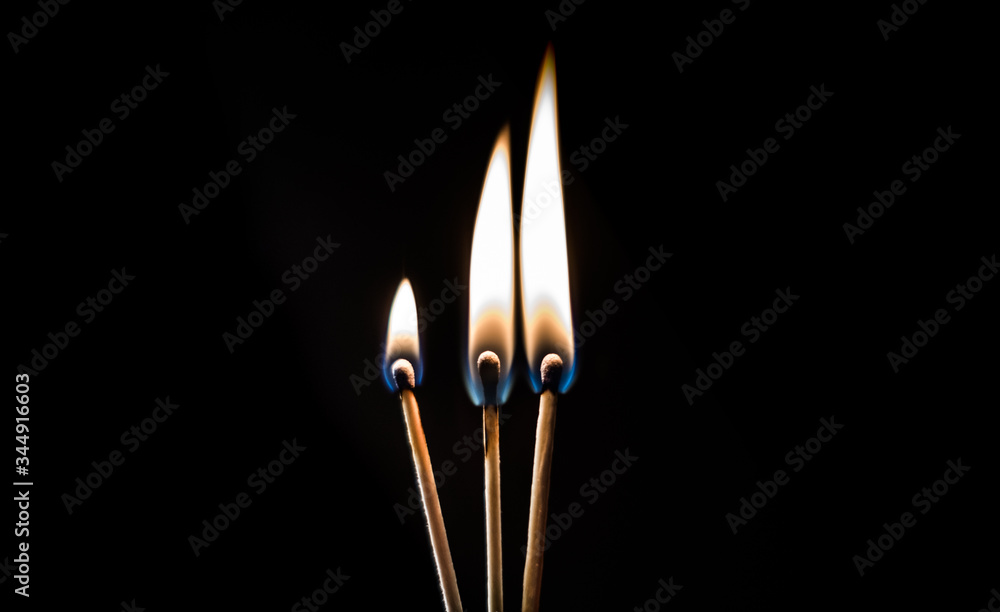 burning matches on a black background burning matches on a black background
