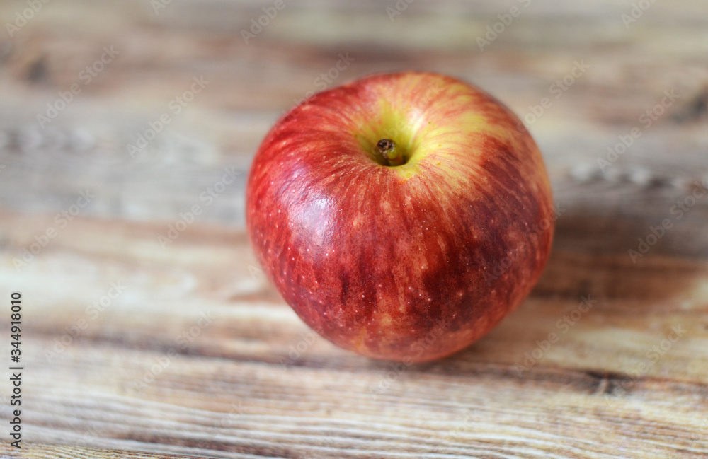 red apples on wooden table red apples on wooden table