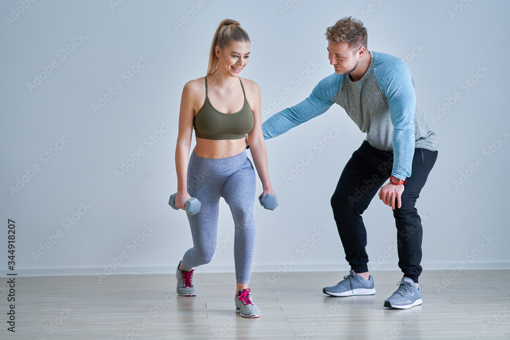 Woman with her personal fitness trainer Woman with her personal fitness trainer