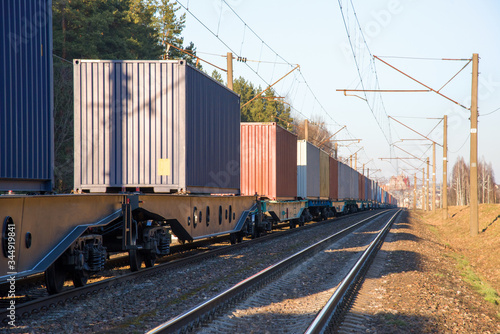 Photo Cargo containers transportation on freight train by railway
