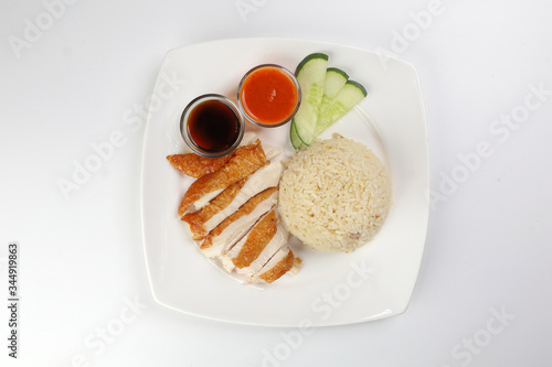 South east asian style chicken rice set steamed roasted sliced chicken with soup dark chilli sauce malaysia china photo