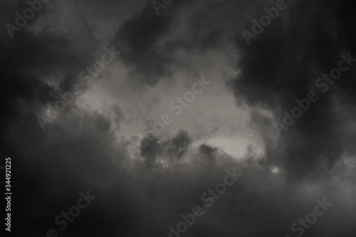 Dramatic thundercloud in dusk sky, rainy and overcast weather. Natural meteorology background. Blurred motion, soft focus. Cloudscape scenery image ready for design, replace sky in photo editor.