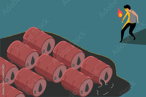 A worker is holding a fire torch to burn oil barrels because too much oil is produced until there is no storage.  Crisis, oversupply, falling prices  Caused by less demand from the world market.
