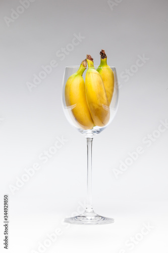 glass with yellow bananas