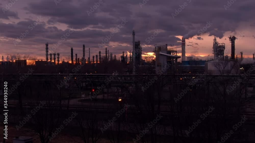 Oil Refinery in Bratislava, Slovakia - Aerial Establishing Crane Shot of an Oil and Gas Factory Polluting Environment During a Cloudy Twilight Sunset in a Cold Winter Day Oil Refinery in Bratislava, Slovakia - Aerial Establishing Crane Shot of an Oil and Gas Factory Polluting Environment During a Cloudy Twilight Sunset in a Cold Winter Day