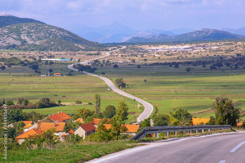 Autumn Balkan road trip. Bosnia and Herzegovina, Republika Srpska, Zubacko polje. View of Grab village and road to Trebinje city