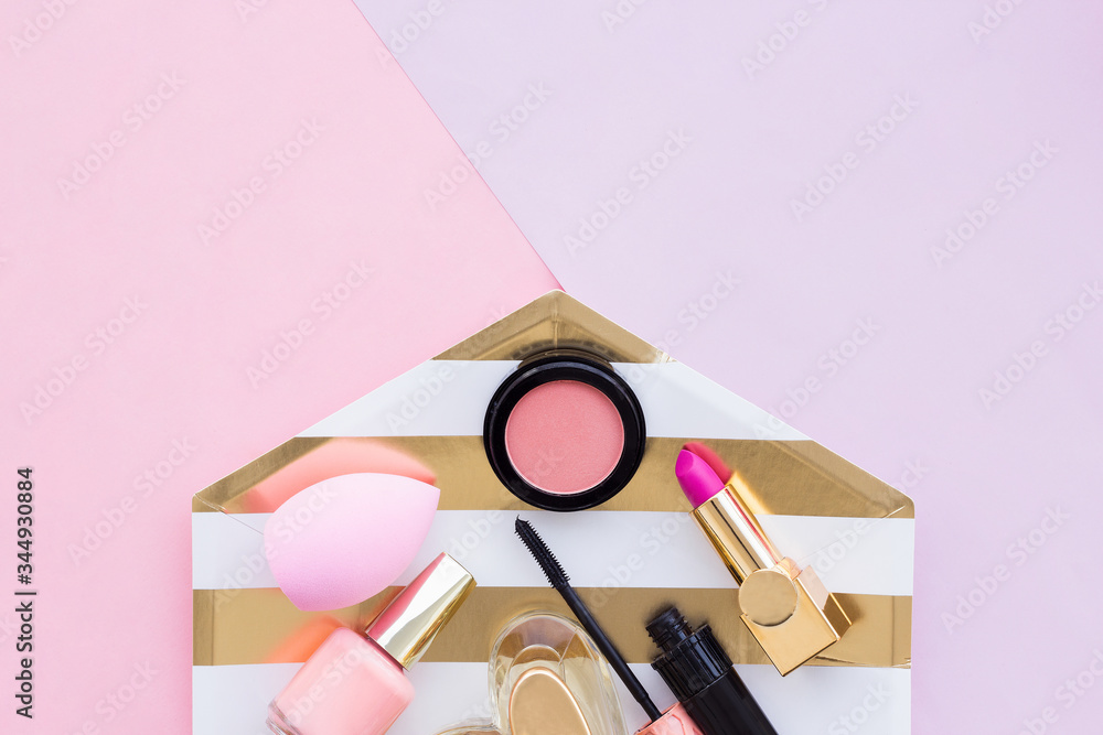 Make up products close up in a rosy background Make up products close up in a rosy background