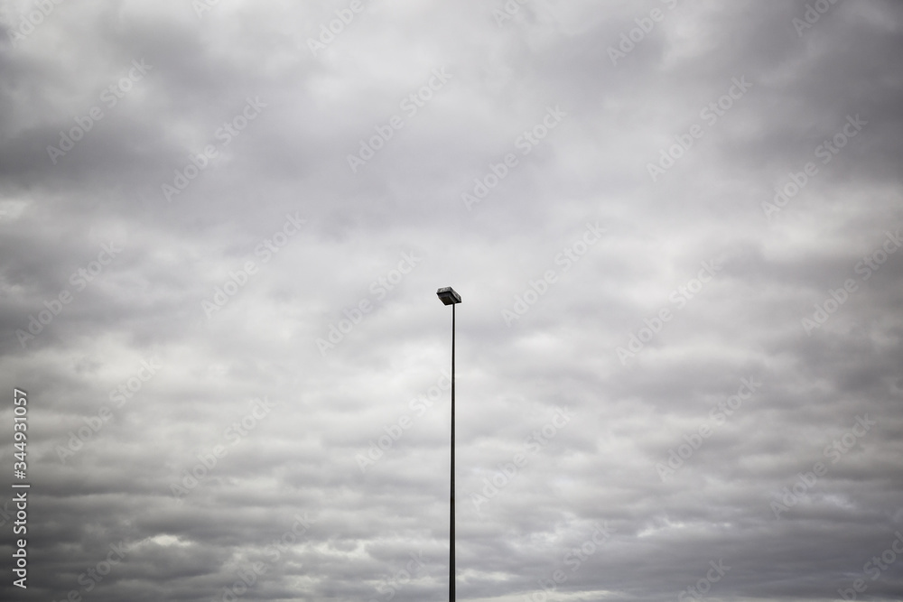 Lamppost and cloudy sky