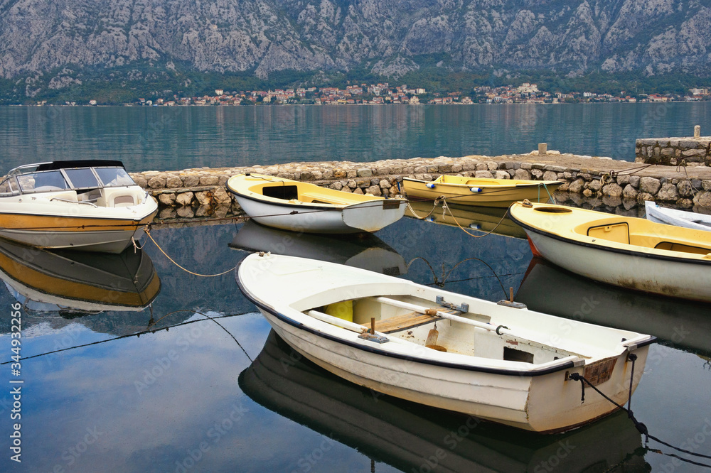 Fishing boats in small harbor, autumn. Montenegro, Adriatic Sea,  Bay of Kotor near Prcanj town