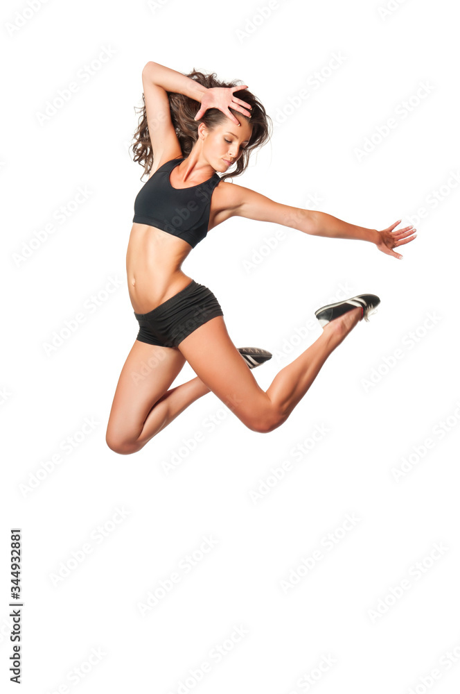 Fitness sporty woman jumping in studio and smiling. Full length shot of young attractive female on white background. Weight loss and well being concept Fitness sporty woman jumping in studio and smiling. Full length shot of young attractive female on white background. Weight loss and well being concept