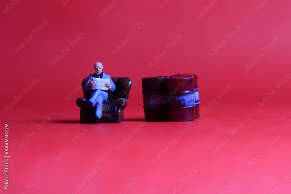 Photo Close Up, Scale HO Sitting old Businessman and Red Oil Barrel, for your element design oil or fuel related