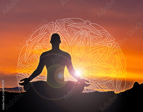 silhouette of a woman or man meditating photo