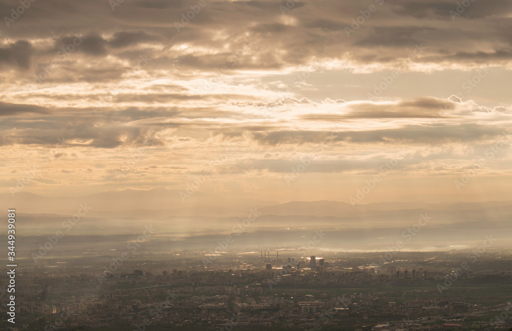The capital of Bulgaria poured with rays of light in the early mourning. Almost aerial view of the city from the surroundings of Vitosha mountain.