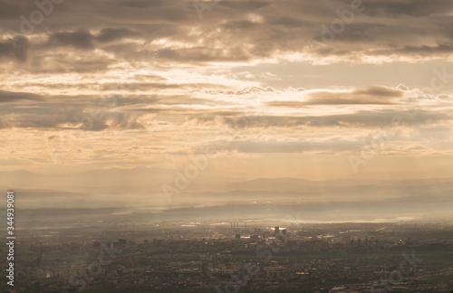 The capital of Bulgaria poured with rays of light in the early mourning. Almost aerial view of the city from the surroundings of Vitosha mountain.