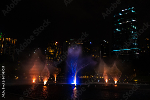 Night view of the dancing multi-colored fountains. Show of Singing Fountains