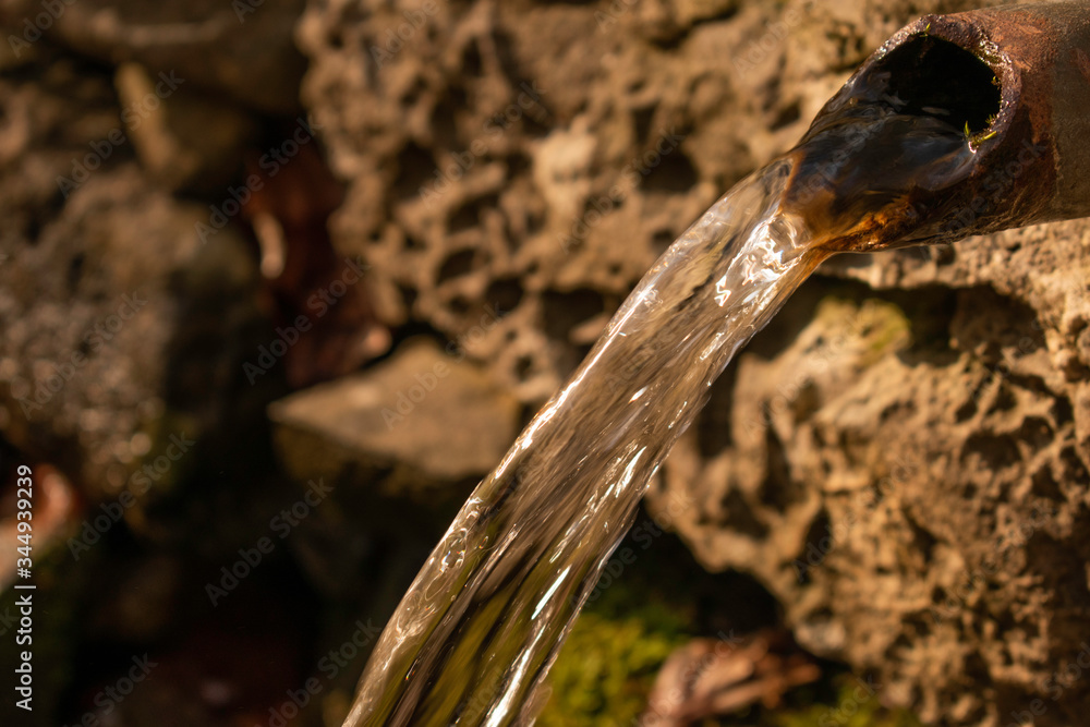 An old hand made fountain in the deep forest of Vitosha mountain near Simeonovo neighborhood, full of water in springtime. An old hand made fountain in the deep forest of Vitosha mountain near Simeonovo neighborhood, full of water in springtime.