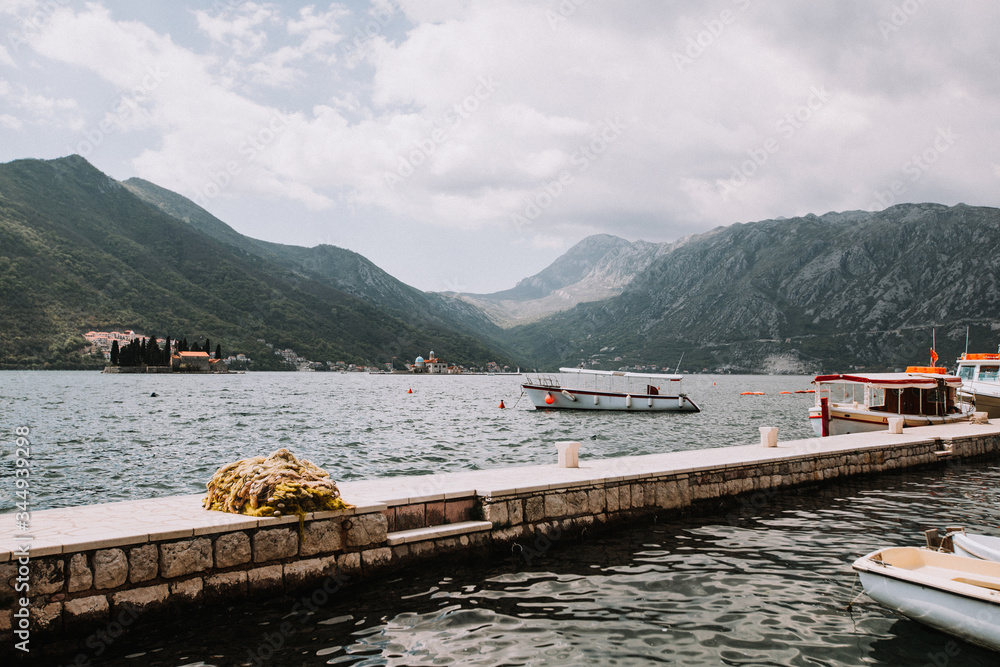 Perast, Montenegro. Bay view. Boats on the water. A little film grain for atmosphere. 
