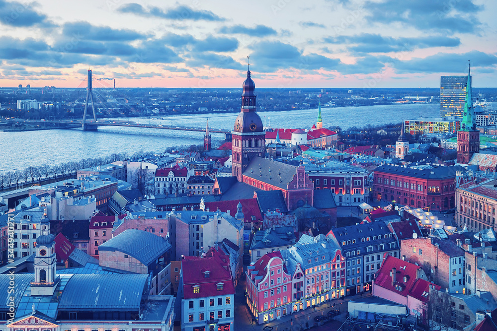 Naklejka premium Riga Dome Cathedral and Daugava River sunset