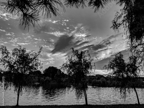 Black and White Photography of Sunset over the lake in Alexandru Ioan Cuza Park, Bucharest photo