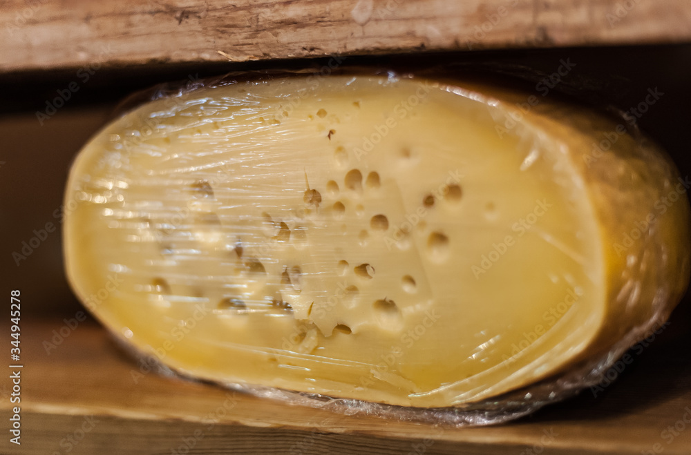 Traditional Dutch cheese displayed for sale in shop market Traditional Dutch cheese displayed for sale in shop market