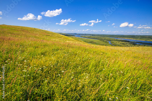 beautiful hills on the high bank of the river Vyatka on a sunny day in summer
