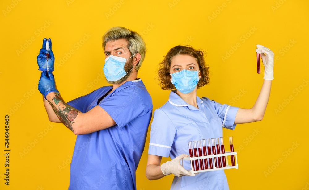 syringe and medicine. medical couple use testing tube vaccination. say no coronavirus. virus remedy in lab. doctor wear respirator mask. infection vaccine and blood test. Medical professional working