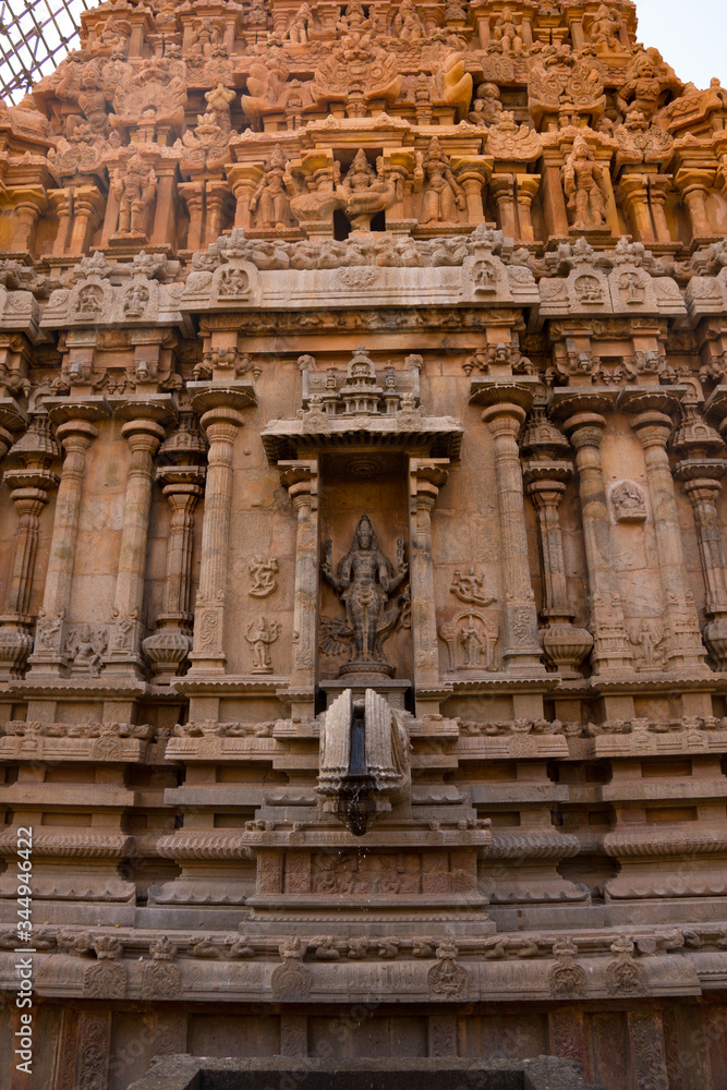 A beautiful picture of a Hindu idol in the wall of a temple in India