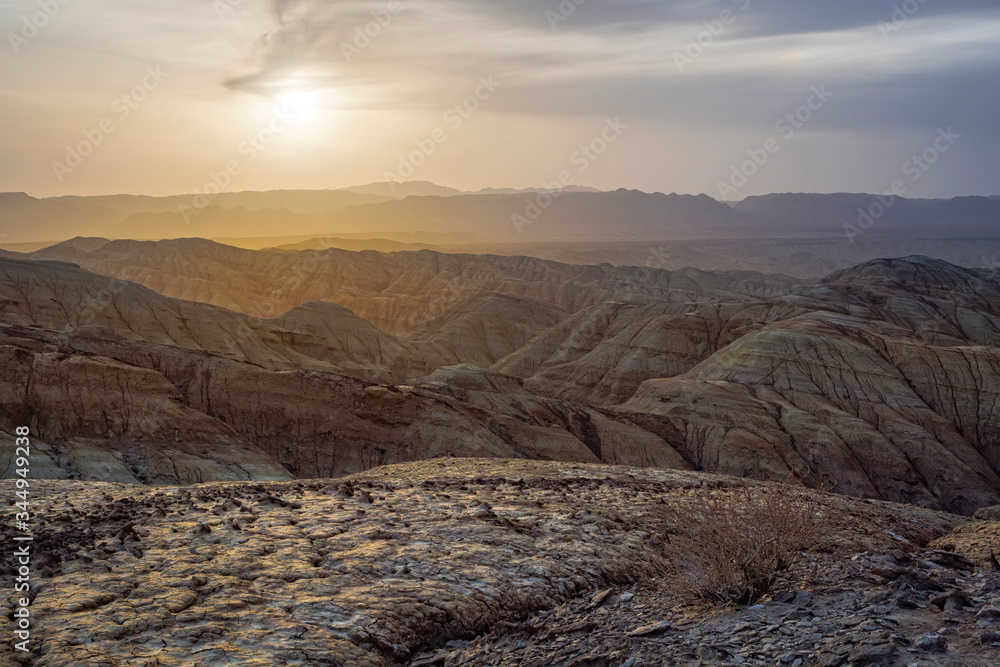 Sunset in the desert area in the mountains. Fancy Sand Canyons. National Park Altyn-Emel. Kazakhstan