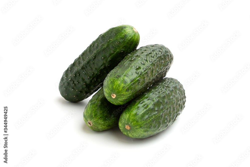 Bright green cucumbers whole isolated on a white background Bright green cucumbers whole isolated on a white background