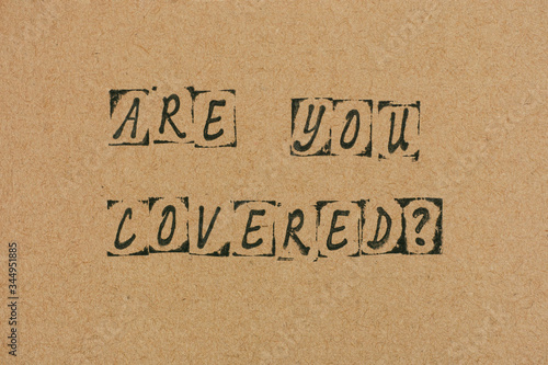 Cardboard with words Are You Covered?