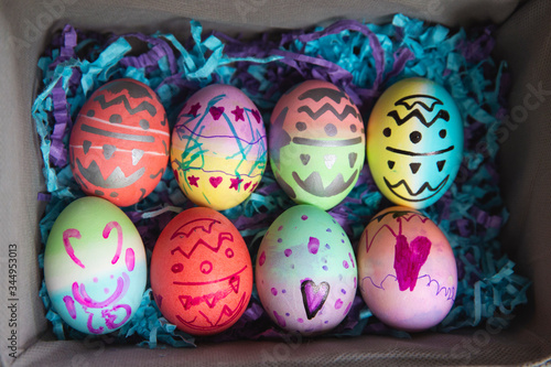 Box of beautifully dyed, coloured, stamped, and decorated Easter eggs photo